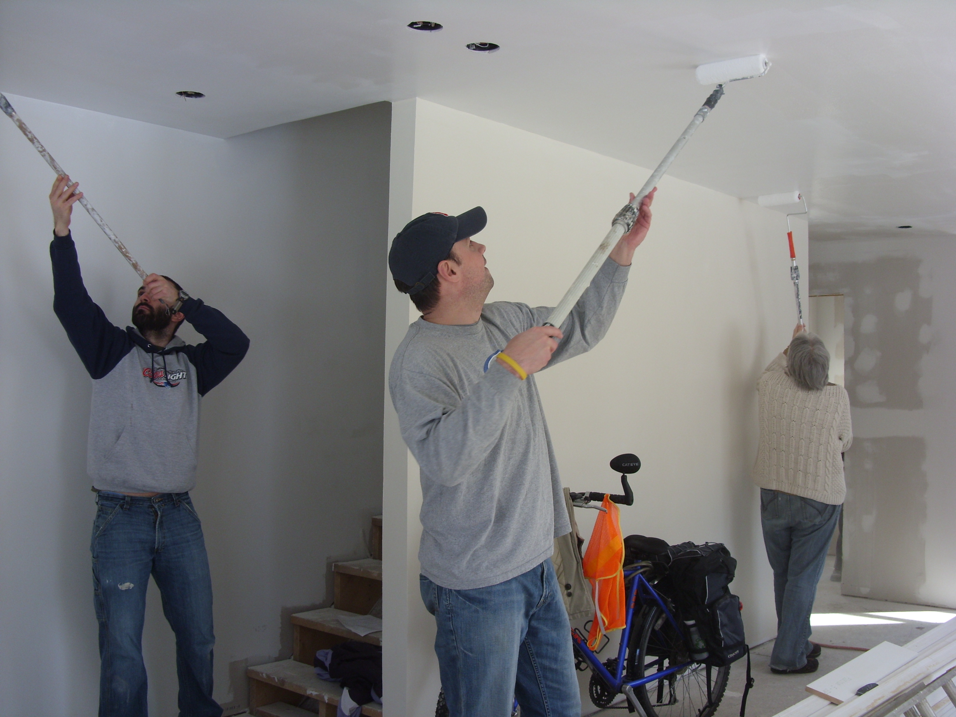 volunteers painting ceiling